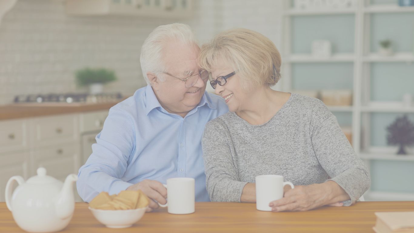 Older Canadian couple reviewing their Term 100 life insurance policy at home