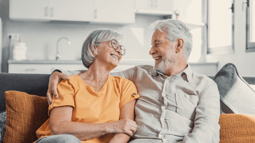 Couple discussing their joint last to die life insurance in their home.